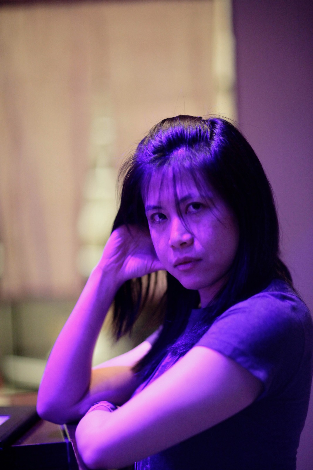 Mysterious Gaze in Purple Light