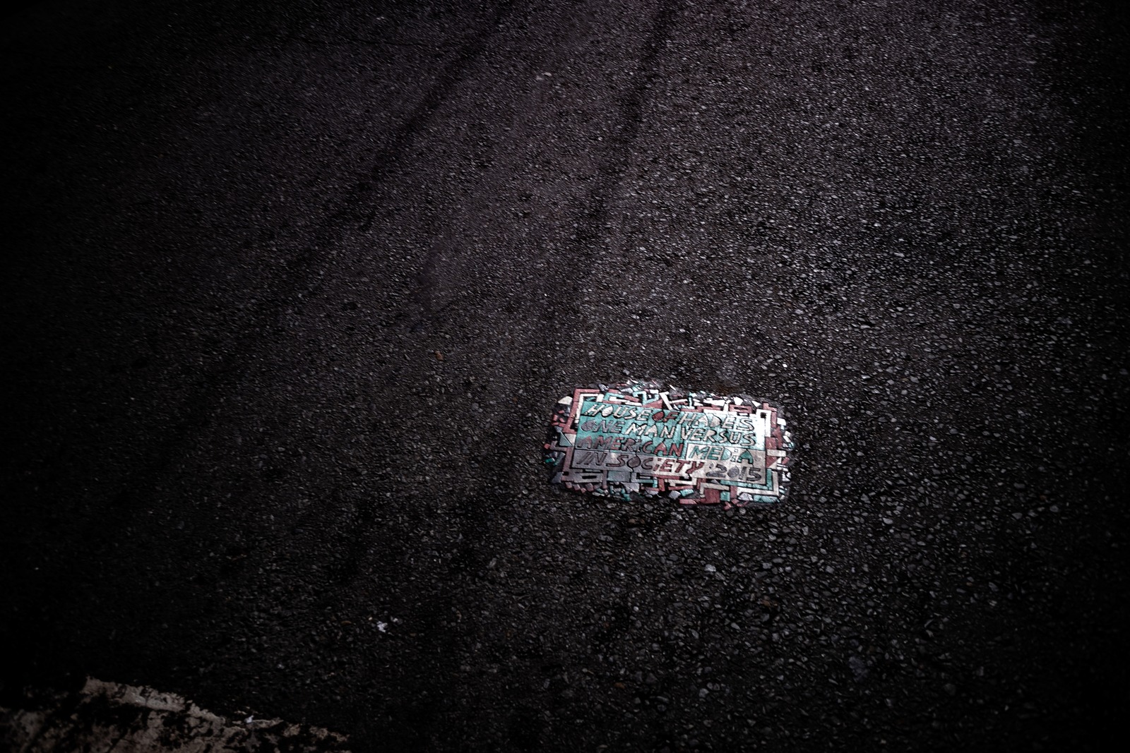 Forgotten Sign on Asphalt