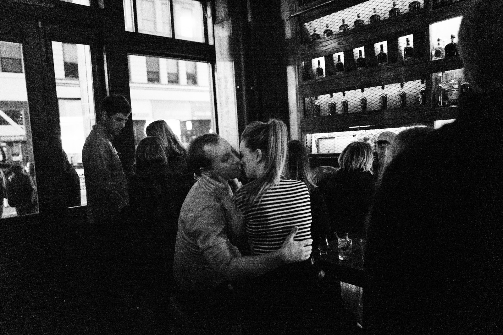Intimate Moments in a Crowded Bar