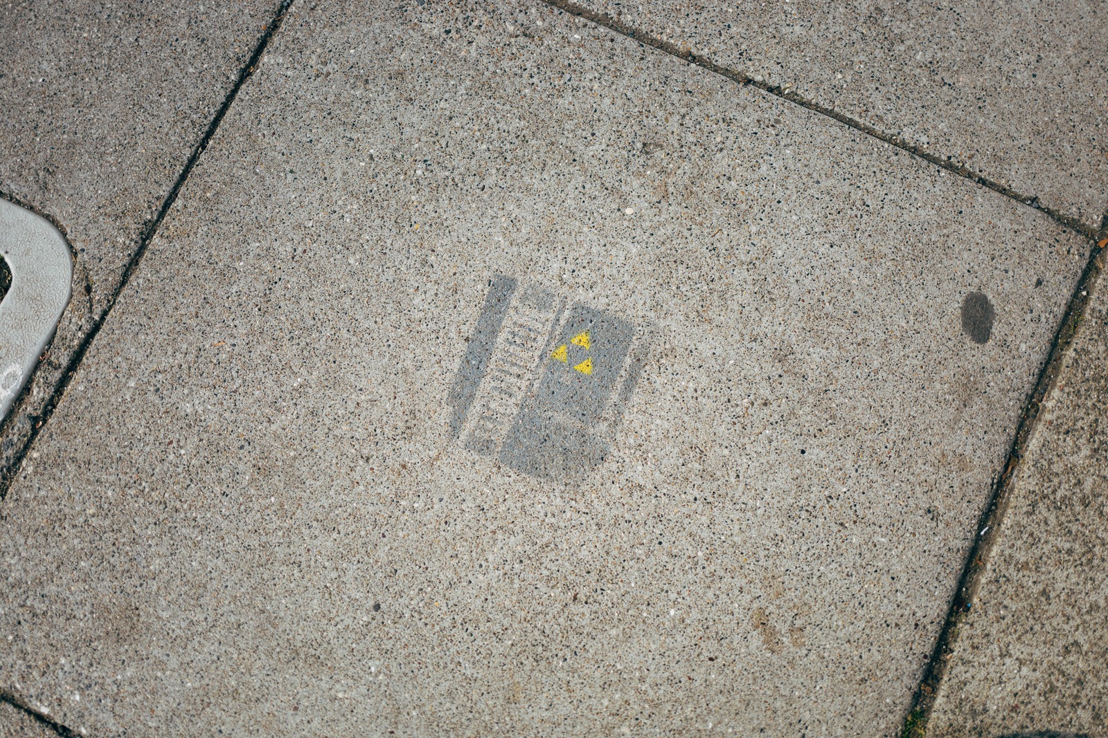 Faded Warning on Concrete