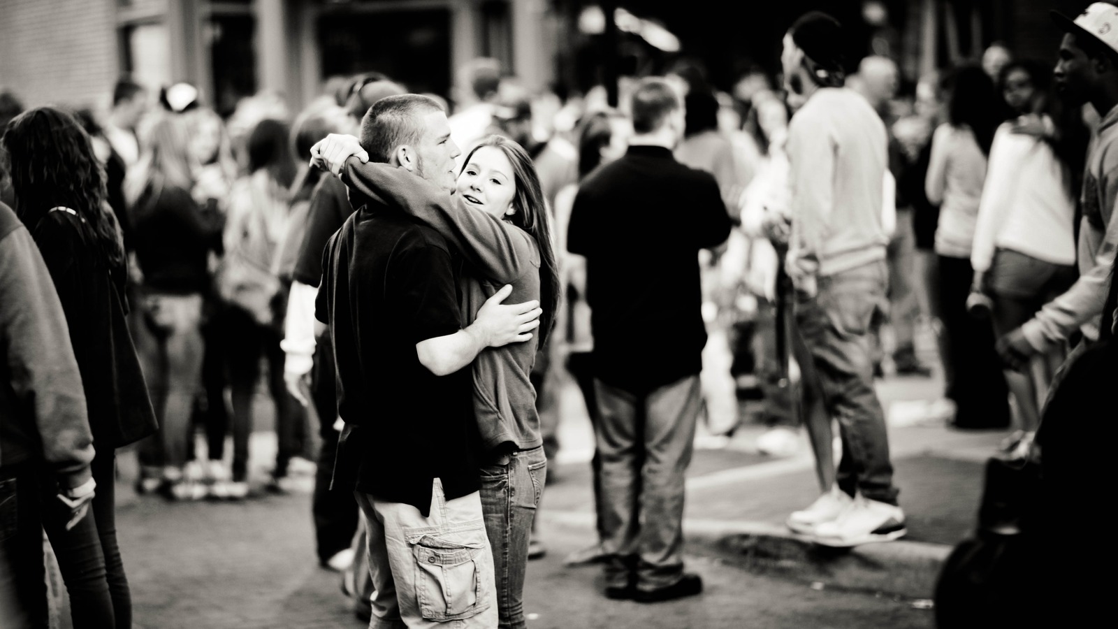 Joyful Embrace in a Crowd