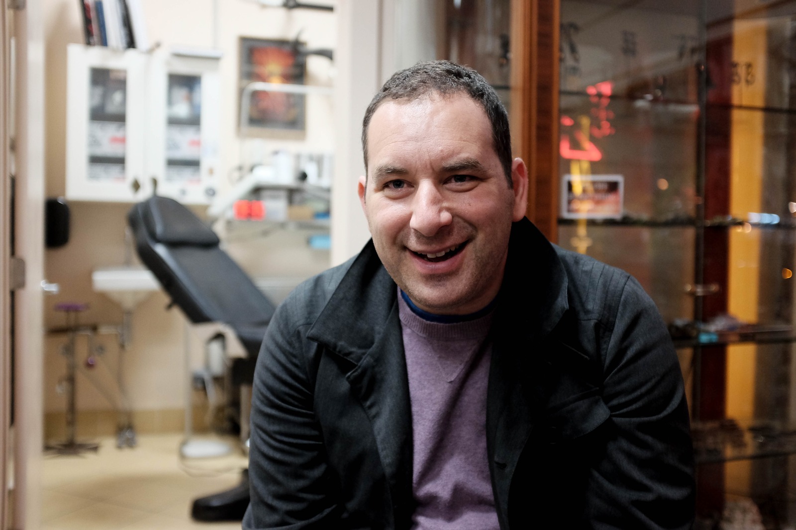 Candid Charm in a Tattoo Studio