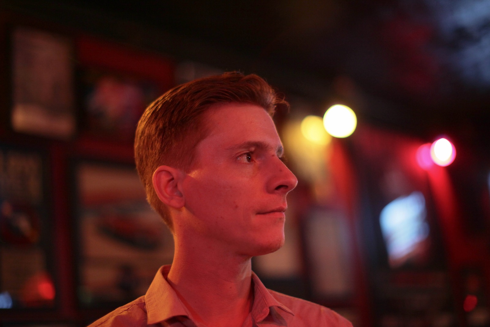 Contemplative Moment in Red Light