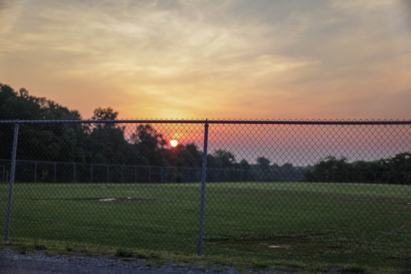 Sunset Behind the Fence