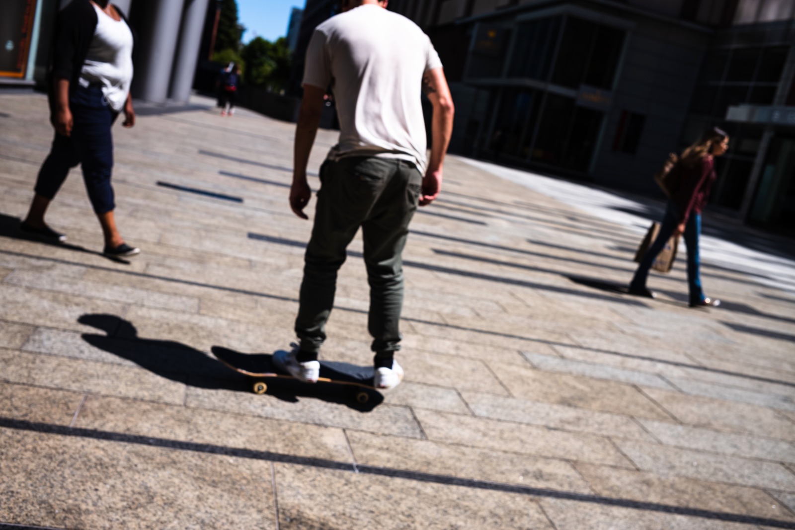 Urban Skateboarder Amidst Pedestrians