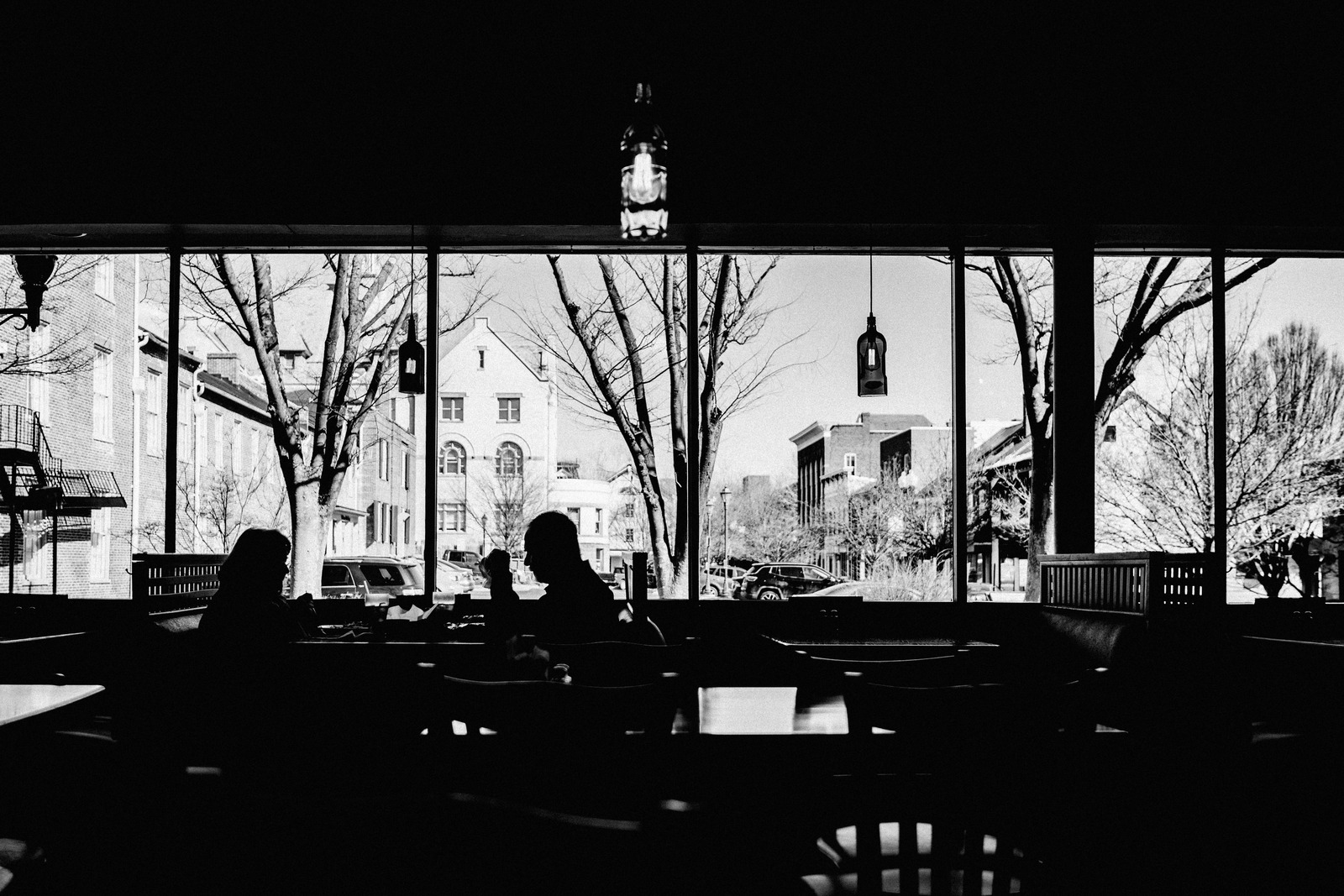 Silhouettes in a Café