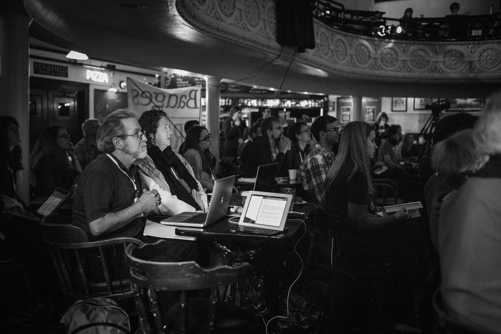 Engaged Audience in Somber Light