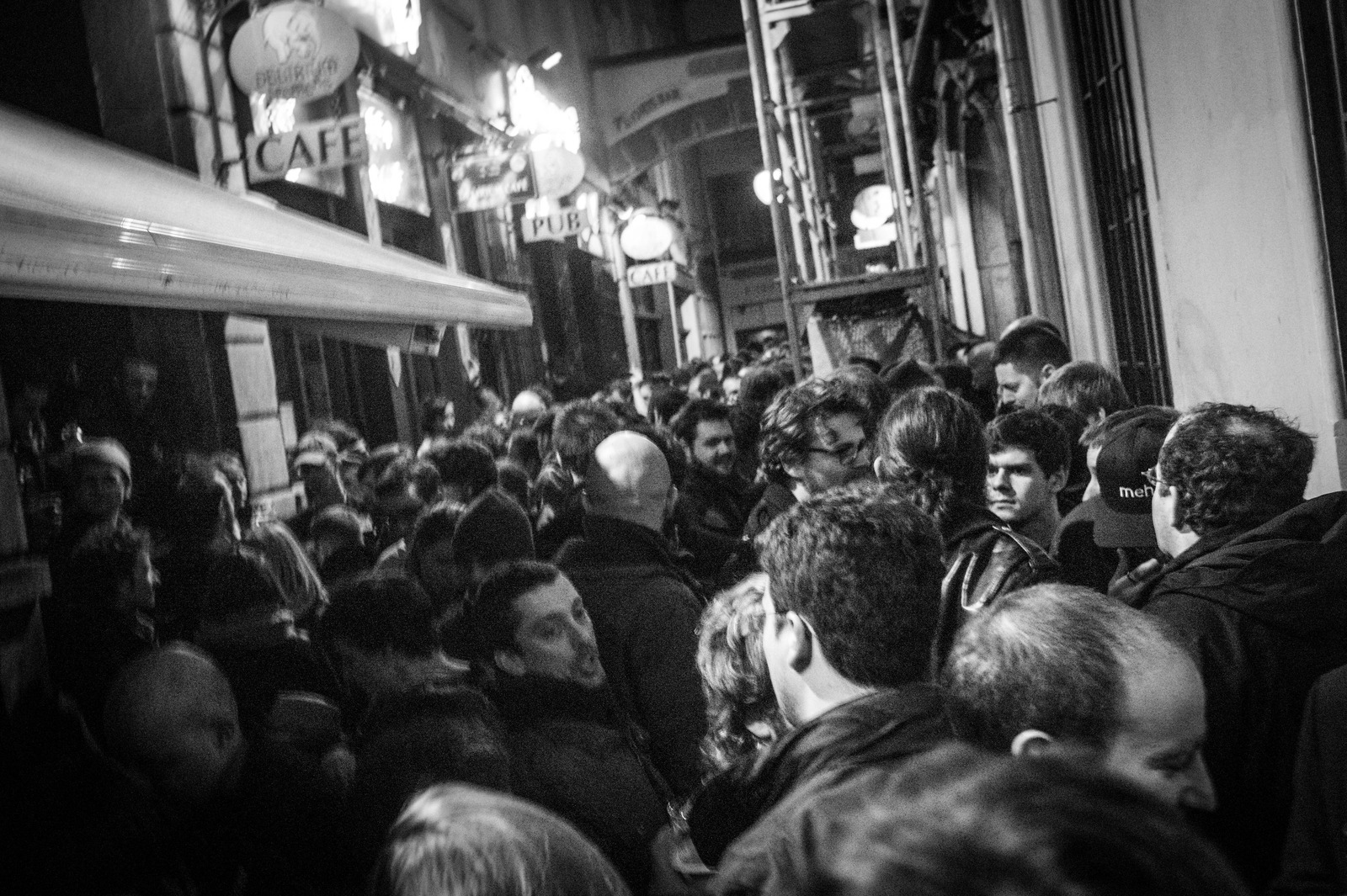 Nighttime Crowd in a Narrow Alley
