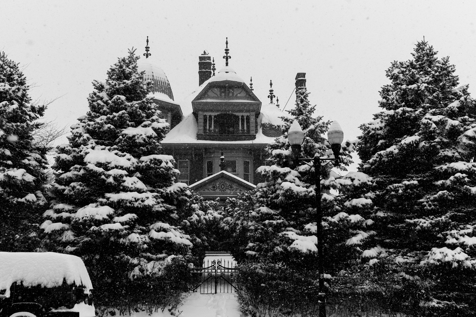 Winter's Embrace on an Old Mansion