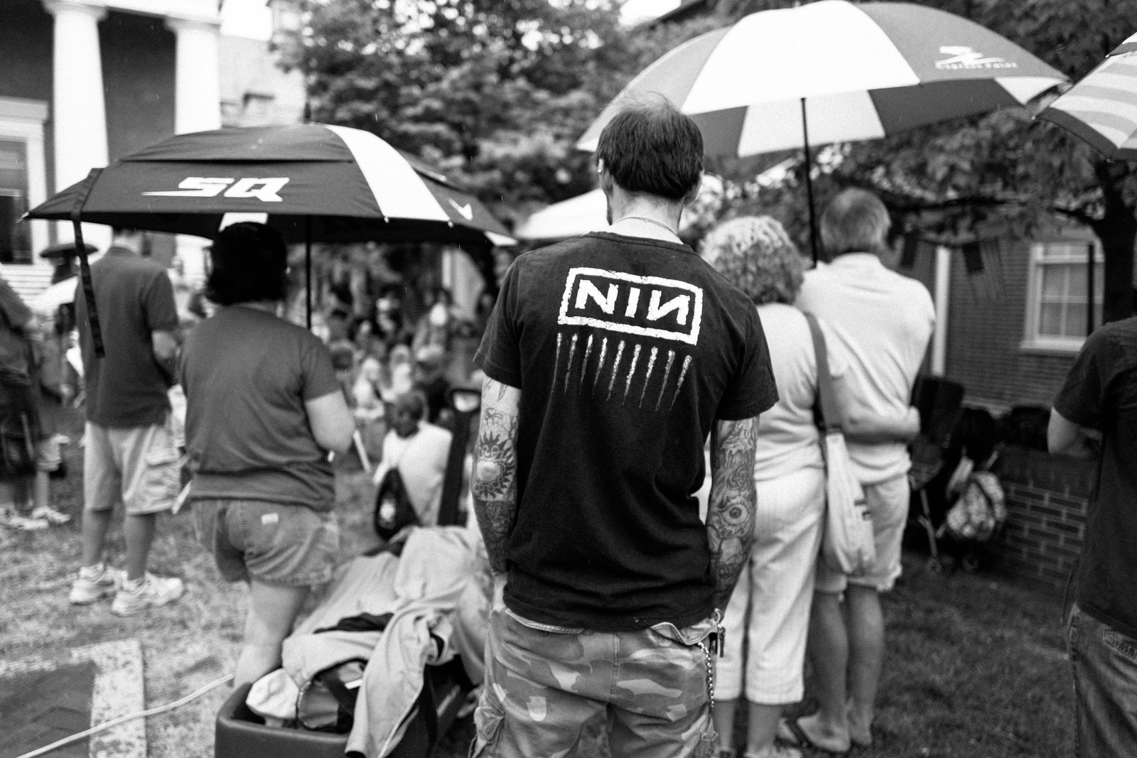 A Crowd Under Umbrellas