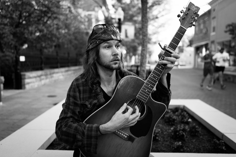 Melancholic Musician in the Park