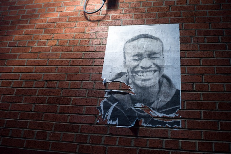 Faded Joy on Brick Wall