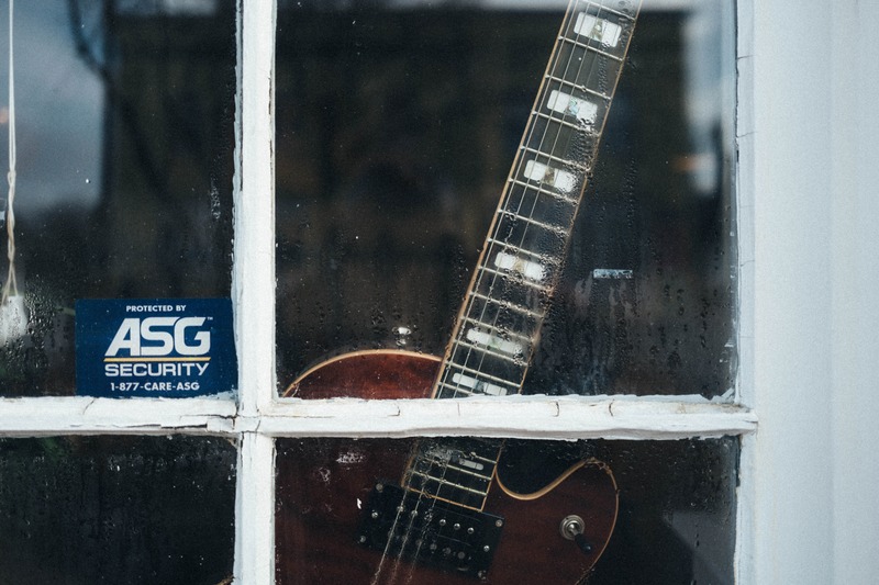 Guitar Behind Foggy Glass