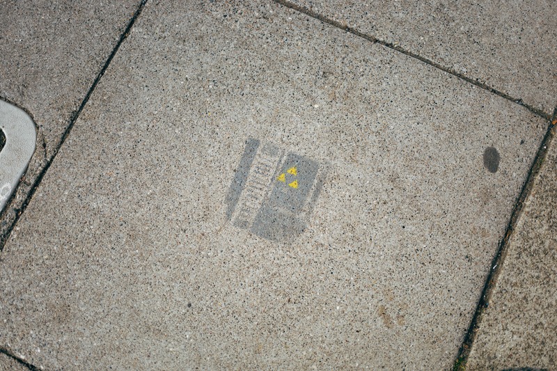Faded Warning on Concrete