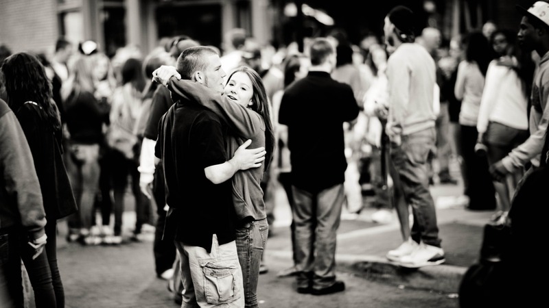 Joyful Embrace in a Crowd