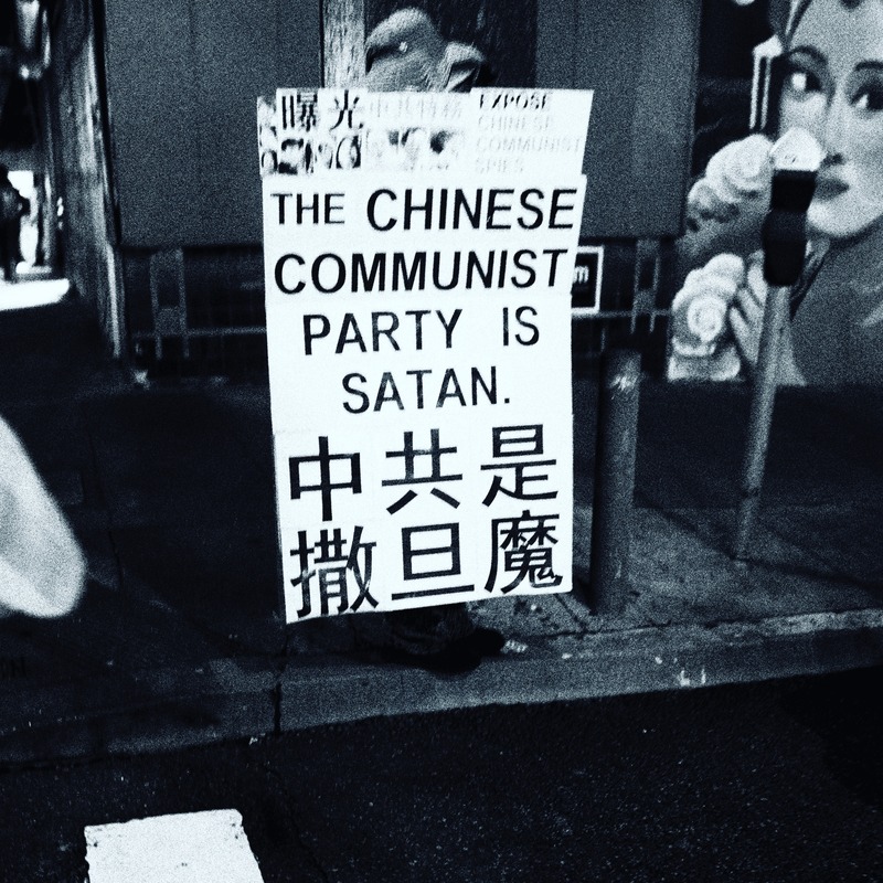 Protest Sign in Shadows