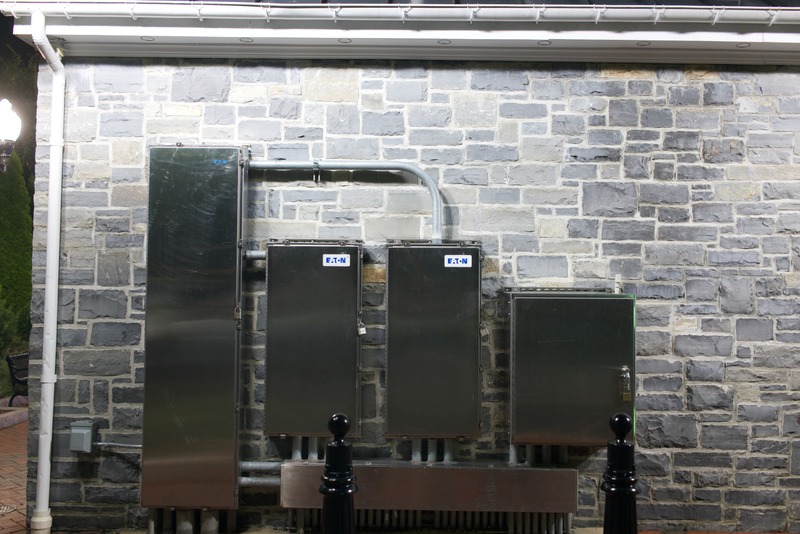 Industrial Contrast on Stone Wall