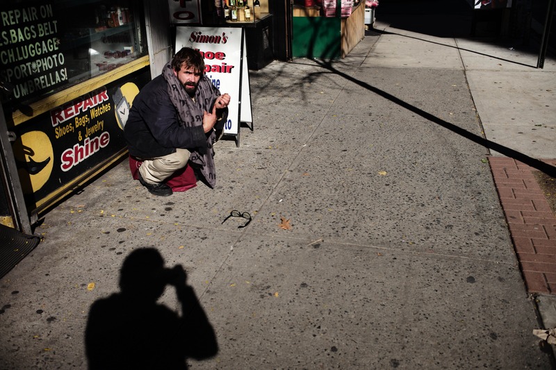 Silent Plea on the Sidewalk
