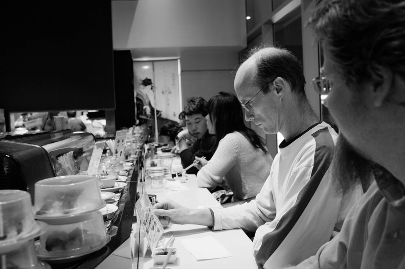 Contemplative Moments at Sushi Bar